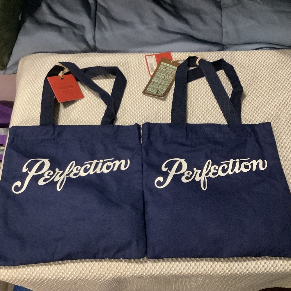 2 Mossimo Supply Co. Dark Blue 10”x10.5” Cloth “PERFECTION” bags NWT